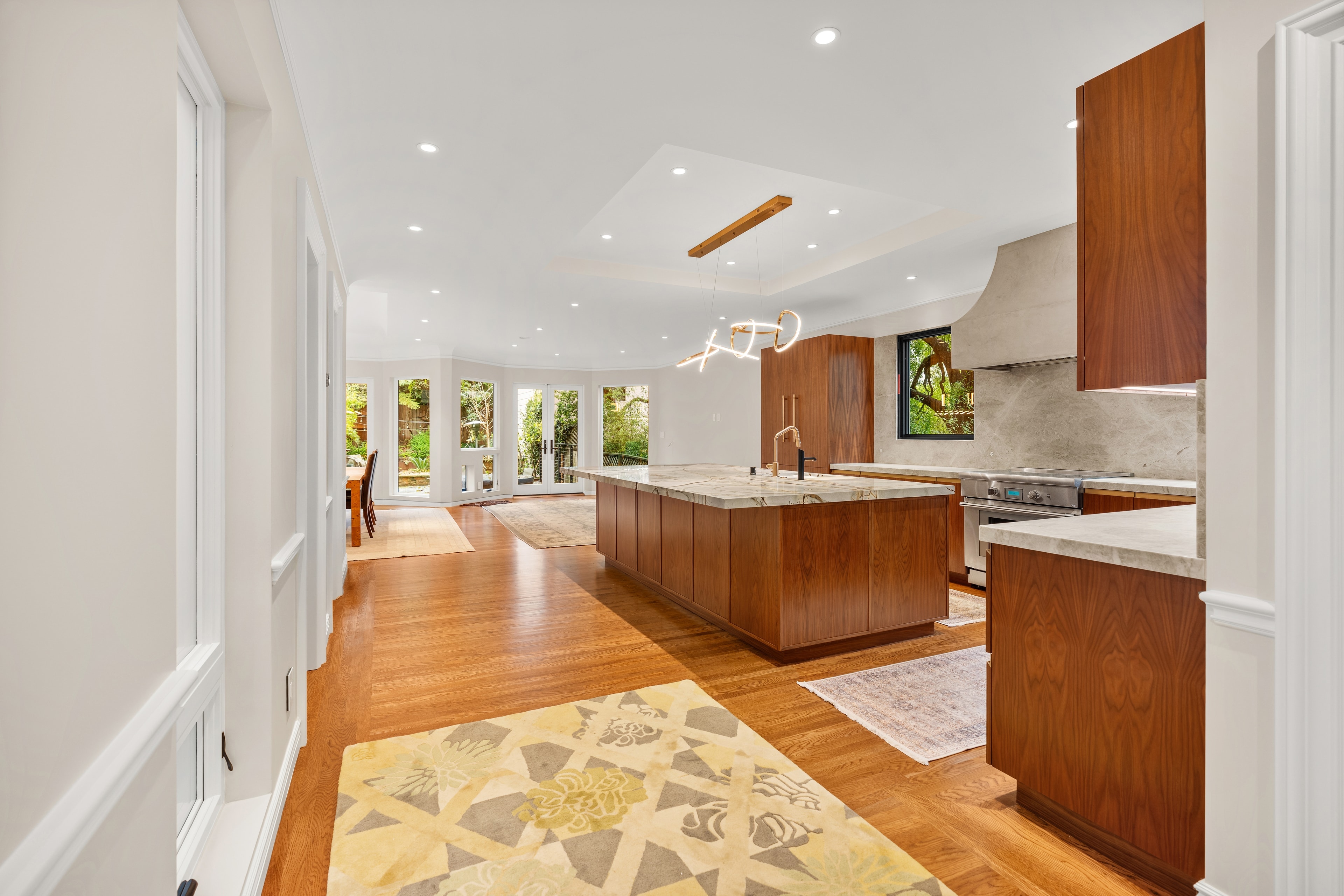 Custom home office with built-in cabinetry and mountain views