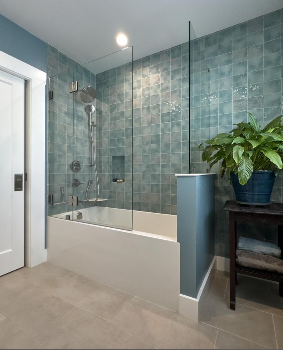 Marble tile walk-in shower with brass rain head